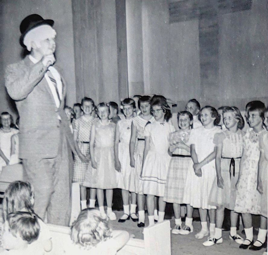 Herman directing school choir